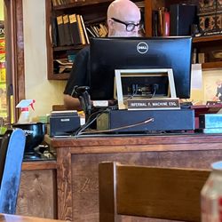 Heights Cigar Lounge - The owner Paul just before he walked away from the counter and left a customer standing there waiting.