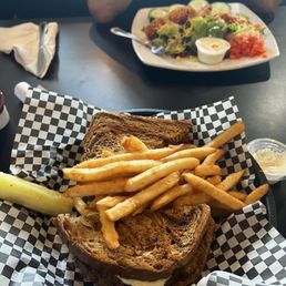 Patty melt with fries and Buffalo chicken salad