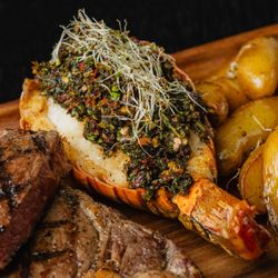 Blu Seafood - Blu Surft and Turf
Tender 10oz angus cut with a delicious lobster tail on butter sauce and chimichurri