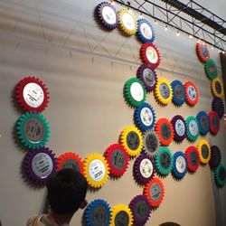 Big Monster Toys - Gear wall showing the number of years people work for BMT