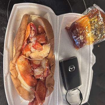 Angie’s Lobster - Jumbo Lobster roll with key fob (for reference of size) and spicy honey sauce - Sandwiches Near Me - Phoenix, Arizona