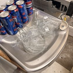 Drinking fountain outside of bathroom