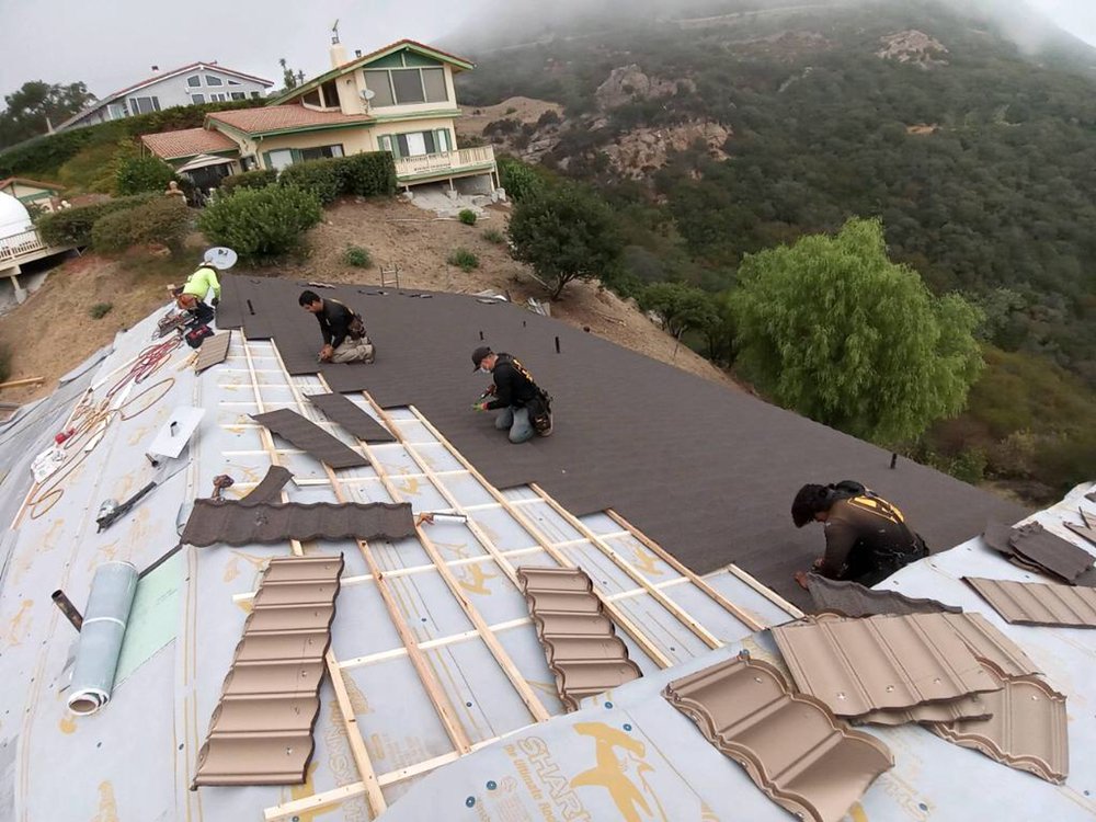 Slide of Reno's Roofing