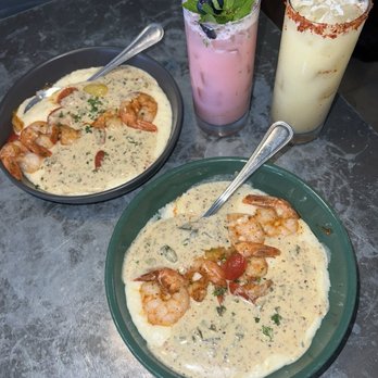 Leeland House - Shrimp and grits + their version of a painkiller and coconut mojito from the seasonal menu - Restaurants Near Me - Galveston, Texas Leeland House - Shrimp and grits + their version of a painkiller and coconut mojito from the seasonal menu - Restaurants Near Me - Galveston, Texas