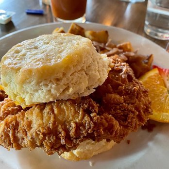 The Overpass Merchant - $13 the H.C.C.B. (honey chicken cheddar biscuit) crispy chicken, aged cheddar, honey butter drizzle - Gastropubs Near Me - Baton Rouge, Louisiana