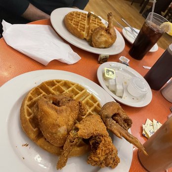 Amy Ruth's - Tommy Tomita in the foreground and Reverend Sharpton (leg & thigh combo) in the back - Southern Near Me - New York, New York