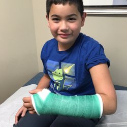 Professional Orthopedics - And on goes the new cast. Happy patient.
