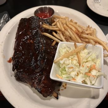 Carlyle Grill - Half slab of BBQ Baby Back ribs, with shoestring fries and a side of coleslaw. - American Near Me - Ann Arbor, Michigan