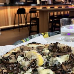 KING SHROOM PIZZA with hot honey drizzled on top KING SHROOM PIZZA with hot honey drizzled on top