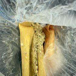El Rosal Bakery - Chicken green sauce tamale. Right side chicken red sauce tamale