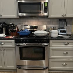 Le Creuset Outlet Store - Sauteuse, 5 qt braiser, 3 qt rice pot, 10 inch skillet.  The tea kettle is behind the sauteuse.