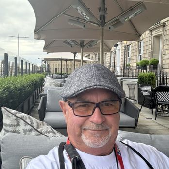 Marriott Courtyard - Outside courtyard area with patio heaters built in to the large umbrellas.  Never rained while here but the temps dropped in the evening - Hotels Near Me - Edinburgh, EDH