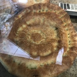 two flatbreads on a counter two flatbreads on a counter