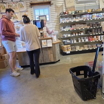 Jamison's Farm Market - Two customers paying for their shopping items at the cashier's counter. - Fruits & Veggies Near Me - Roanoke, Virginia