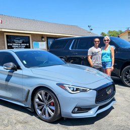 Pair of new cars: Infiniti Q60 Red Sport and Premier Duramax Suburban
