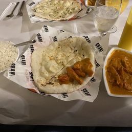 Butter chicken with plain naan, jasmine rice and a Mango Lassi. Butter chicken with plain naan, jasmine rice and a Mango Lassi.