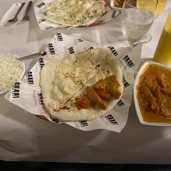 Shahi Indian Grill - Butter chicken with plain naan, jasmine rice and a Mango Lassi.