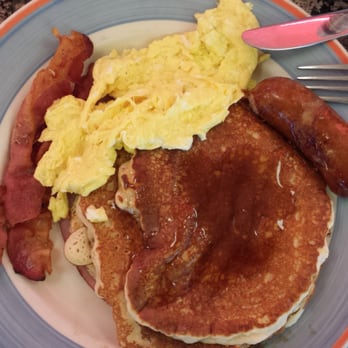 Metro Diner - Lumberjack breakfast: bacon, sausage, eggs, three pancakes, and a hidden slice of Canadian bacon underneath. - Diners Near Me - New York, New York Metro Diner - Lumberjack breakfast: bacon, sausage, eggs, three pancakes, and a hidden slice of Canadian bacon underneath. - Diners Near Me - New York, New York