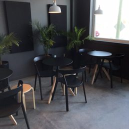 tables and chairs in a coffee shop