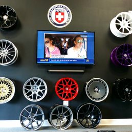 Customer sitting area; well appointed with a big screen TV, HRE wheels to envy, and several Recaro seats. Customer sitting area; well appointed with a big screen TV, HRE wheels to envy, and several Recaro seats.