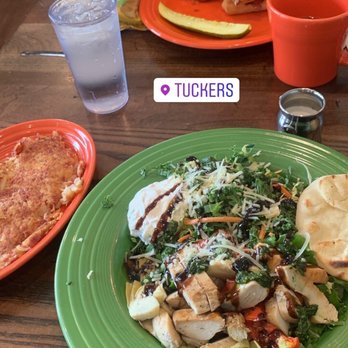Tucker's - a green plate with a salad and a sandwich on it - American Near Me - Concord, New Hampshire Tucker's - a green plate with a salad and a sandwich on it - American Near Me - Concord, New Hampshire