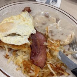 Biscuits and Gravy with bacon and sausage... never got my sausage after I asked twice! Biscuits and Gravy with bacon and sausage... never got my sausage after I asked twice!