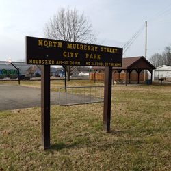 Small park with basketball, shelter, and swings