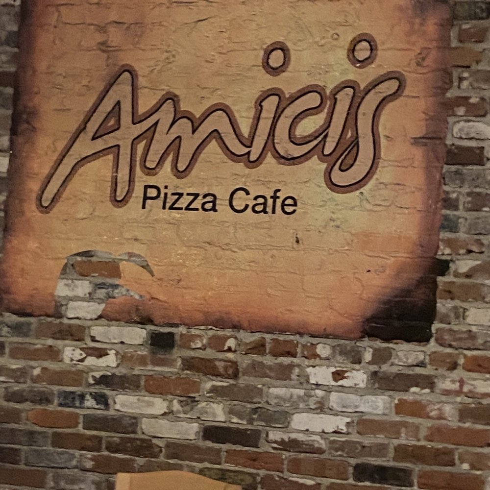 Amici's - a brick wall with a sign on it - Pizza Near Me - Suffolk, Virginia Amici's - a brick wall with a sign on it - Pizza Near Me - Suffolk, Virginia