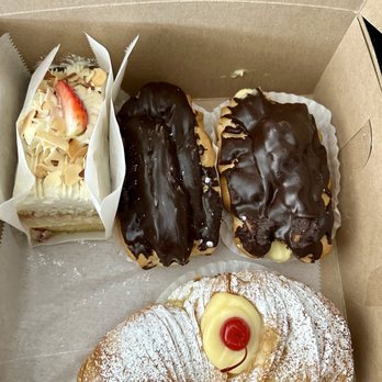 Utica bakery - Italian rum cake, eclairs and a lobster tail. - Bakeries Near Me - Apex, North Carolina Utica bakery - Italian rum cake, eclairs and a lobster tail. - Bakeries Near Me - Apex, North Carolina
