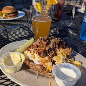 The Drake - Loaded brisket mac and cheese potato - Bars Near Me - Burlington, Iowa