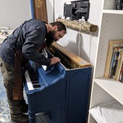 Clare's Player Pianos - Justin doing the initial inspection of our piano.