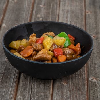 Noodle Master - a bowl of food on a wooden table - Noodles Near Me - Baytown, Texas Noodle Master - a bowl of food on a wooden table - Noodles Near Me - Baytown, Texas