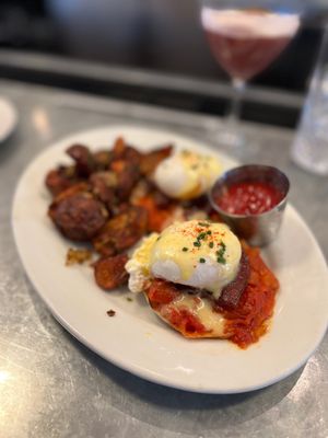 Photo of Guildhall - Glencoe, IL, US. BENEDICT Maple braised pork belly, melted cherry tomatoes, home fries, hollandaise