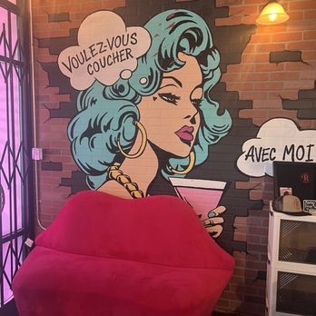 Lady R Bistro - Art work on the wall with a cute pink couch - Burgers Near Me - Menifee, California Lady R Bistro - Art work on the wall with a cute pink couch - Burgers Near Me - Menifee, California