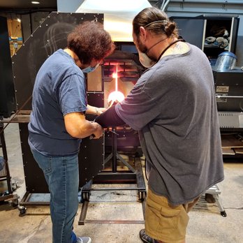 Seattle Glassblowing Studio & Gallery - Preparing the glass to roll on colors - Art Galleries Near Me - Seattle, Washington Seattle Glassblowing Studio & Gallery - Preparing the glass to roll on colors - Art Galleries Near Me - Seattle, Washington