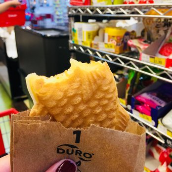 Taiyaki House - a hand holding a piece of food - Street Vendors Near Me - Niles, Illinois Taiyaki House - a hand holding a piece of food - Street Vendors Near Me - Niles, Illinois