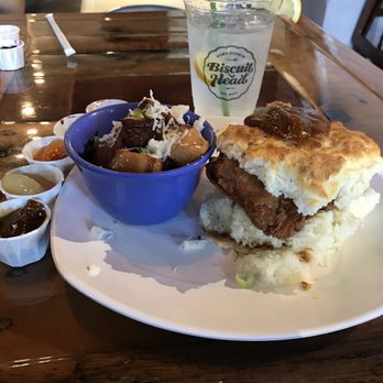 Biscuit Head - Mimosa Fried chicken biscuit topped with sweet potato jelly and gouda fries - Breakfast & Brunch Near Me - Greenville, South Carolina