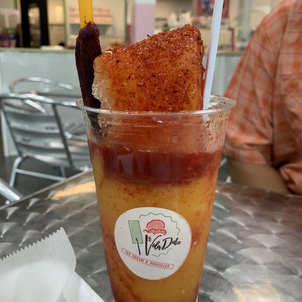 Vida Dulce - Spicy mango slushy: mango sorbet, tajin, chamoy and spicy tamarind stick. - Ice Cream & Frozen Yogurt Near Me - Cary, North Carolina Vida Dulce - Spicy mango slushy: mango sorbet, tajin, chamoy and spicy tamarind stick. - Ice Cream & Frozen Yogurt Near Me - Cary, North Carolina
