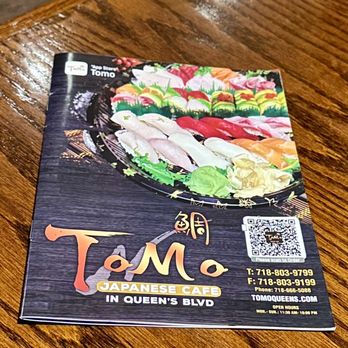 Tomo Japanese Cafe - a menu on a table - Sushi Bars Near Me - Elmhurst, New York