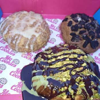Mo Cookies - Snickerdoodle cookie on the left, red velvet cookie on the right, and the Dubai chocolate cookie in the foreground. - Desserts Near Me - Wesley Chapel, Florida Mo Cookies - Snickerdoodle cookie on the left, red velvet cookie on the right, and the Dubai chocolate cookie in the foreground. - Desserts Near Me - Wesley Chapel, Florida