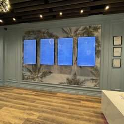 Paradise AIR Cannabis - Menu screens on the wall inside. August 2021