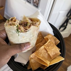Breakfast Burrito bacon, eggs, cheese, cilantro and onions , sour cream! So darn good!