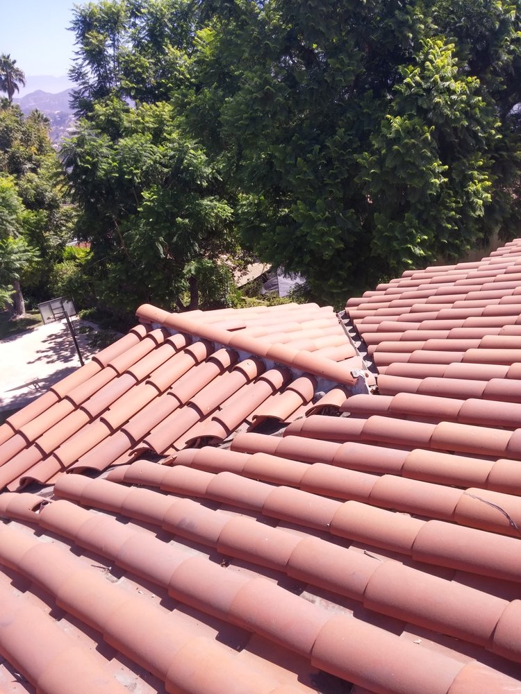 Slide of Armandos Roofing