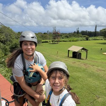 NorthShore Zipline - My family on one of the platforms getting ready to ride another zip-line. - Tours Near Me - Haiku, Hawaii
