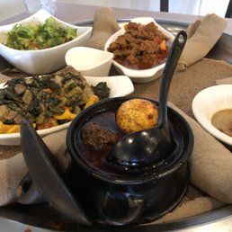 a variety of dishes on a tray a variety of dishes on a tray