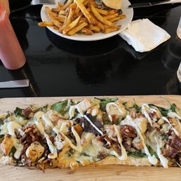Chicken bacon ranch flatbread and grilled chicken sandwich. Chicken bacon ranch flatbread and grilled chicken sandwich.