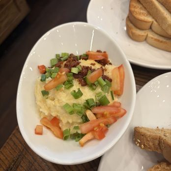 Another Broken Egg Cafe - Loaded Bacon Gouda grits - Breakfast & Brunch Near Me - Winter Park, Florida Another Broken Egg Cafe - Loaded Bacon Gouda grits - Breakfast & Brunch Near Me - Winter Park, Florida