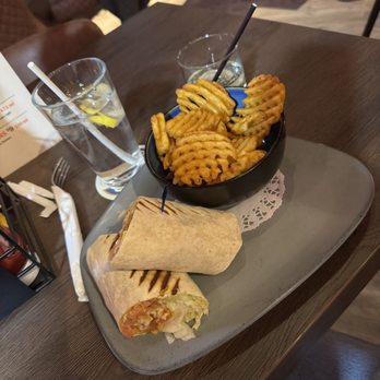 Greedy Goose - buffalo chicken wrap with waffle fries - Vegan Near Me - Toronto, Ontario