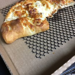 a half eaten pizza in a box a half eaten pizza in a box