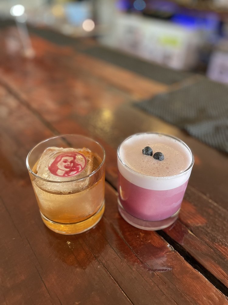 Snitching Lady Distillery Logo